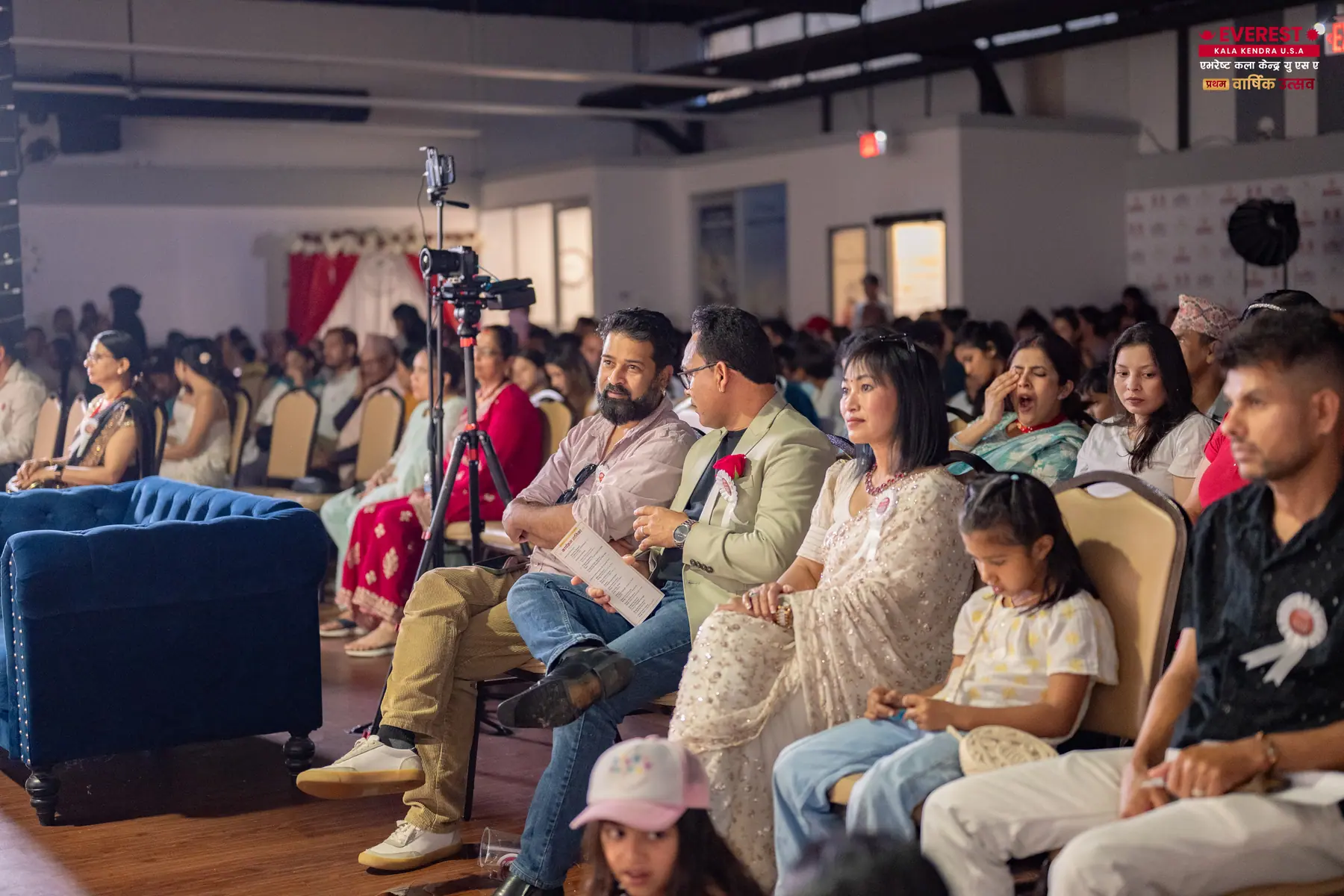 Families seated in the audience watching performances at the EKK annual function