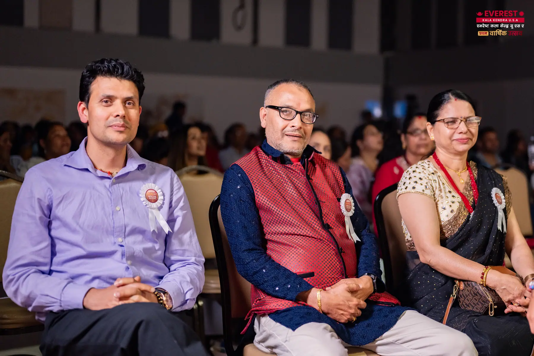 Three guests seated together in the front row at the EKK annual function